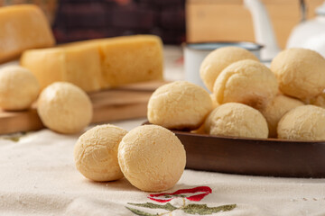 Cheese bread, breakfast table in Brazil, cheese bread, coffee and accessories, selective focus.