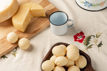 Cheese bread, breakfast table in Brazil, cheese bread, coffee and accessories, selective focus.