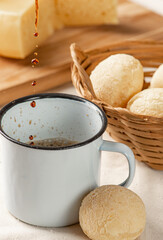 Cheese bread, breakfast table in Brazil, cheese bread, coffee and accessories, selective focus.
