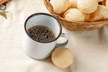 Cheese bread, breakfast table in Brazil, cheese bread, coffee and accessories, selective focus.