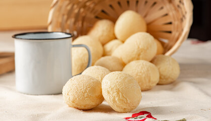 Cheese bread, breakfast table in Brazil, cheese bread, coffee and accessories, selective focus.