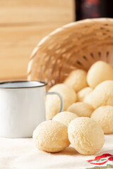Cheese bread, breakfast table in Brazil, cheese bread, coffee and accessories, selective focus.