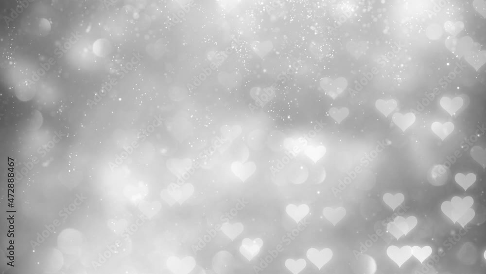 Poster glowing heart symbols motion on silver gray copy space background with falling snow glitter particle