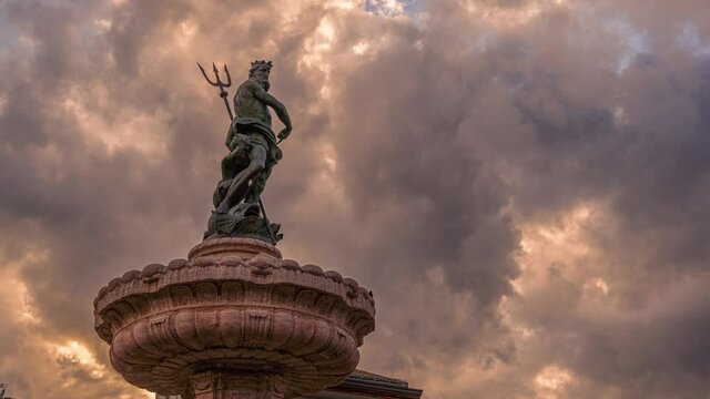 Timelapse of the stormy sky with the fountain of Neptune in the Piazza Duomo in Trento. Trento, autonomous province of Trento, Trentino-Alto Adige, Italy, Europe