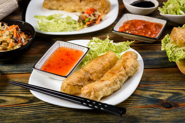homemade spring rolls with vegetables and sauces
