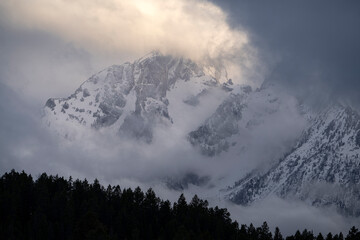 USA, Wyoming, Grand Teton National Park. Spring storm clouds envelope mountains of Teton Range.