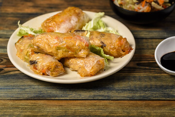 homemade spring rolls with vegetables and sauces