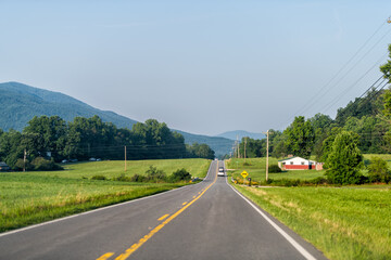 North Carolina highway road with blue sky near Blue Ridge Mountains parkway with countryside rural...