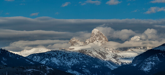 Panoramic of Layers of clouds blanket the Grand Teton and Teton Mountains, Wyoming