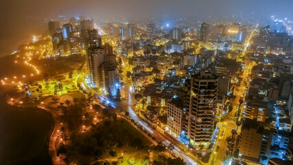 Aerial night view over Miraflores District in Lima Peru