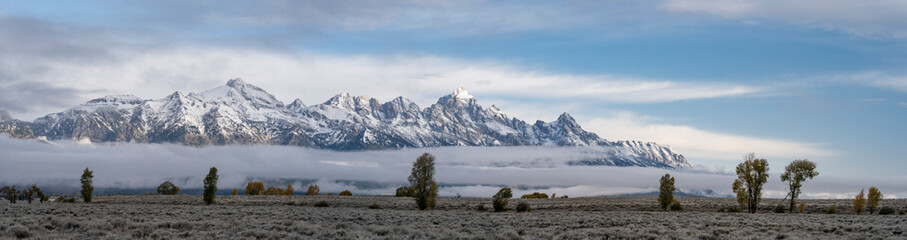 USA, Wyoming. Early morning light on the Teton range with low clouds, Grand Teton National Park.
