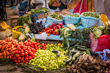 Colored fruit and vegetable sold at traditional Peruvian market, Puno, Peru