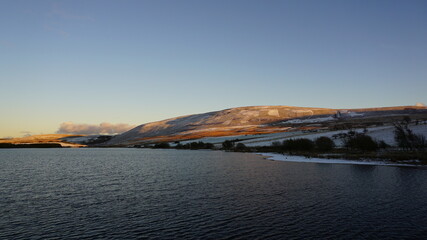 sunset over the lake pentlands scotland winter walks