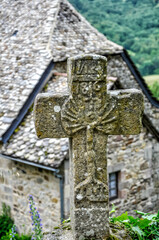 View with stone cross, in the village of Najac