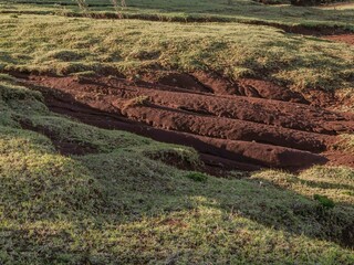 soil erosion and landslide causes trenches on a hill