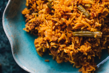 Lubia polo Persian rice dish with ground beef, green beans, turmeric 