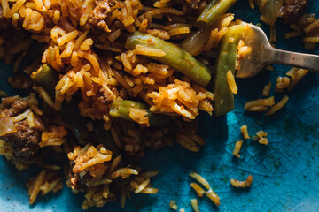 Lubia polo Persian rice dish with ground beef, green beans, turmeric 