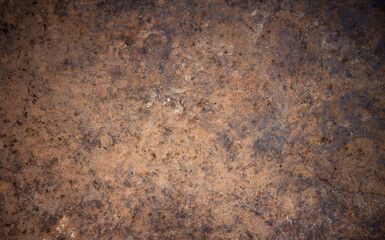 The texture of a rusty iron wall. Metal sheet covered with rust.Metal oxidation. Rusty background for text.