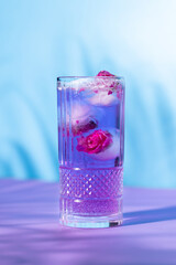 The exotic cocktail and fruit on color background