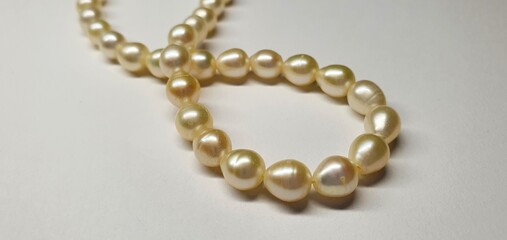 A beautiful necklace made of natural pearls. Pearl jewelry for women. Precious stones.