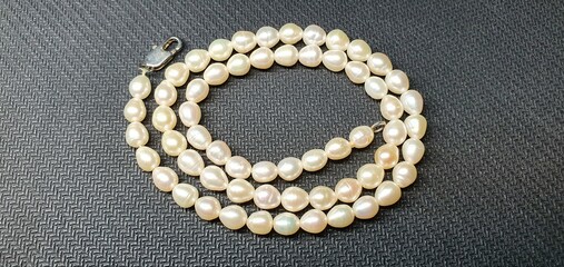 A beautiful necklace made of natural pearls. Pearl jewelry for women. Precious stones.