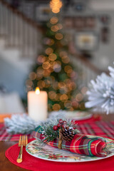 Fototapeta na wymiar Closeup of festive holiday place setting in cozy home