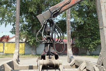 part of an gray iron hydraulic repair mechanism for a truck on the street
