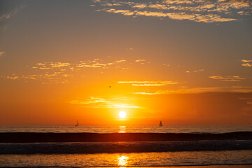 Fototapeta premium Sunrise over the sea and beautiful cloudscape. Colorful ocean beach sunset.