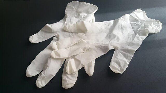 Sterilized gloves and masks used for cleaning and hygiene, representing protection, health safety, and preventive measures against infectious diseases and pandemics.