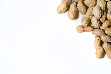 Various peanuts with shell on white background. copy space