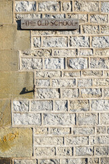 Harome, England - 26 November 2021 - A hand-carved wooden sign saying 