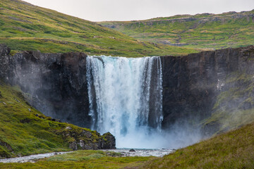 Waterfall gufufoss in river Fjardara in Seydisfjordur in east Iceland