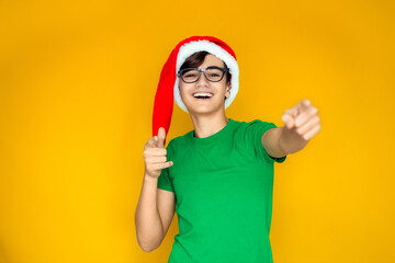 Happy teen in Santa hat on New Year's Eve