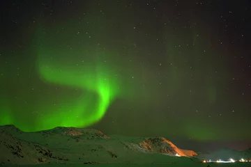 Foto op Canvas Huge shinning northern lights in north Norway close to north cape, aurora © Vendula