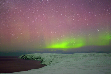 aurora borealis over the sea in Norway