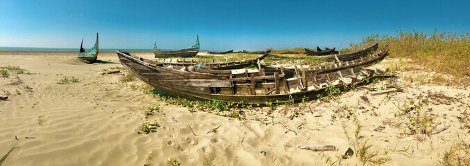 Abandoned boats on a beach in Myanmar.