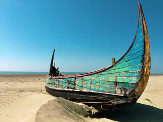 Abandoned boats on a beach in Myanmar.