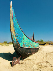 Abandoned boats on a beach in Myanmar.