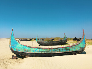 Abandoned boats on a beach in Myanmar.