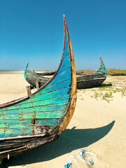 Abandoned boats on a beach in Myanmar.