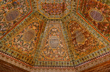 Detail of a painted wooden colorful ceiling, arabesque pattern in Bahia palace,  Morocco, Marrakesh