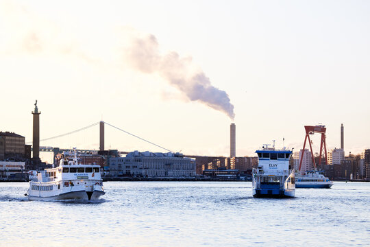 Heavy Traffic With Several Shuttle Boats On The Göta River In Central Gothenburg On A Cold Winter Day.