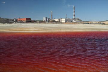 Red water of the lake contaminated with copper smelting waste.