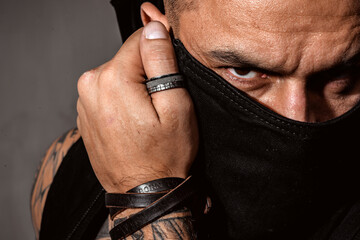 Sexy man cover face. Close up portrait of guy with serious profile face. Guy covered face with...