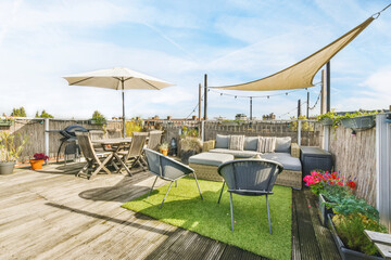 Luxurious and stylish courtyard with a garden umbrella and lots of furniture