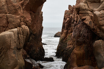 Path of water between rocks in the sea