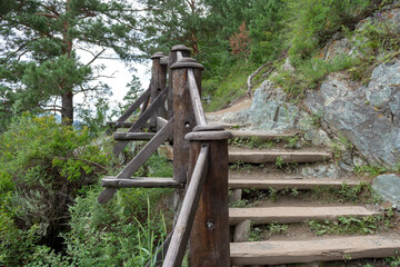 wooden ladder on a dangerous stretch of a steep mountain path