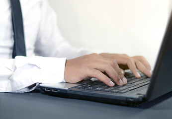 close up hand of   Businessman typing on keyboard or laptop