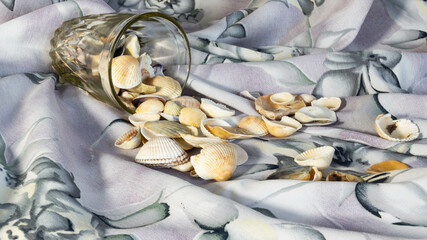 seashells were spilling out of the glass