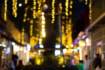 abstract blur image walking street with the festival and led light on tree bangkok Thailand